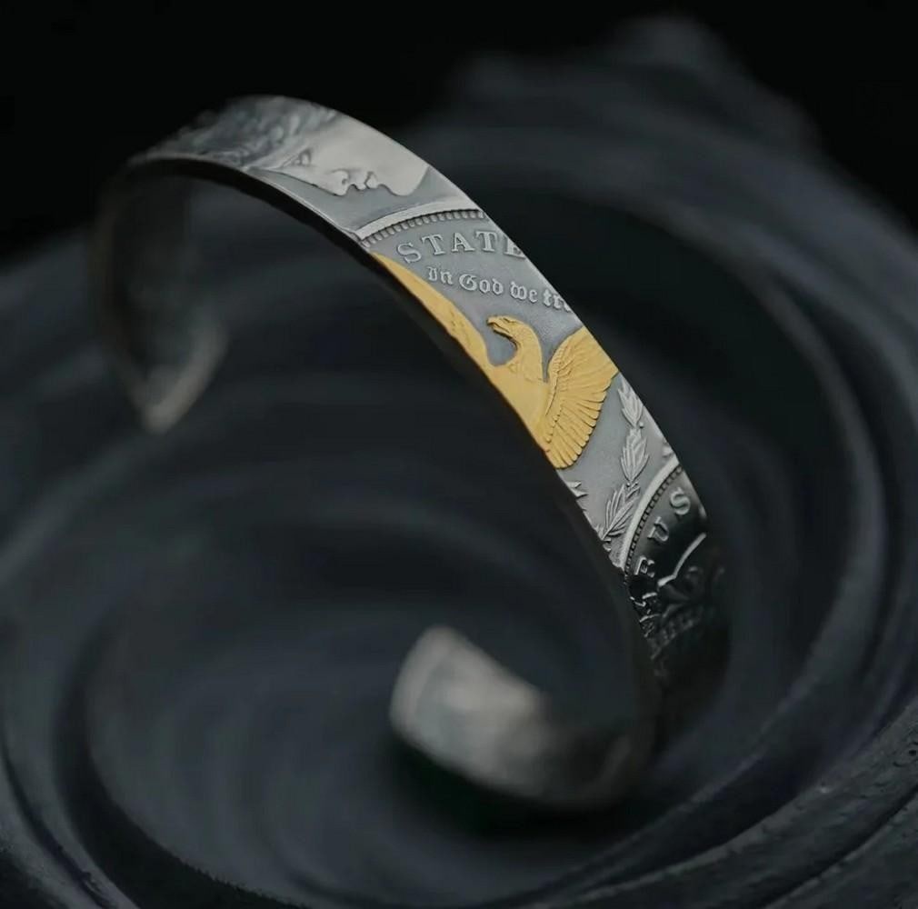 Morgan Silver Coin Bangle: Morgan Silver Coin Bangle Handcrafted from authentic 1921 Morgan silver coins, this double-sided bangle showcases finely preserved details from a bygone era. Carefully cut, polished, and formed by