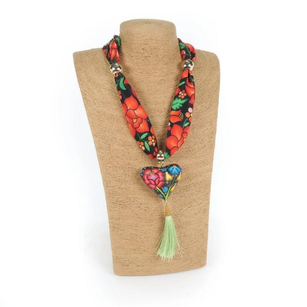 Oaxacan Alebrije Wood Carving Heart & Flowers Necklace: Oaxacan Alebrije Wood Carving Heart & Flowers Necklace Gorgeous heart necklace handcrafted from locally sourced copal wood and painted with colorful floral designs and traditional Zapotec pattern