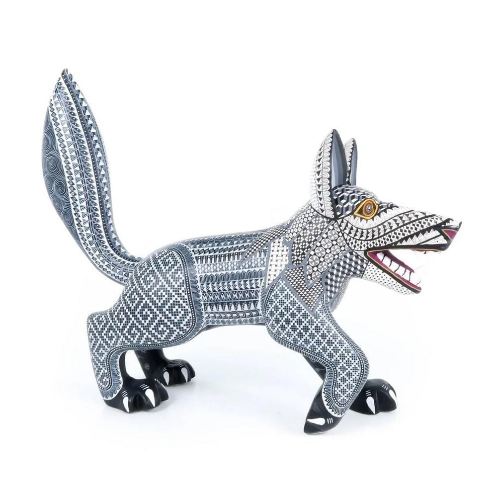Fierce Wolf – Oaxacan Alebrije with Zapotec Iconography: Fierce Wolf – Oaxacan Alebrije with Zapotec Iconography Carved from a single large piece of copal wood by the masterful Fabian family, this striking alebrije captures the spirit of Oaxaca's anci