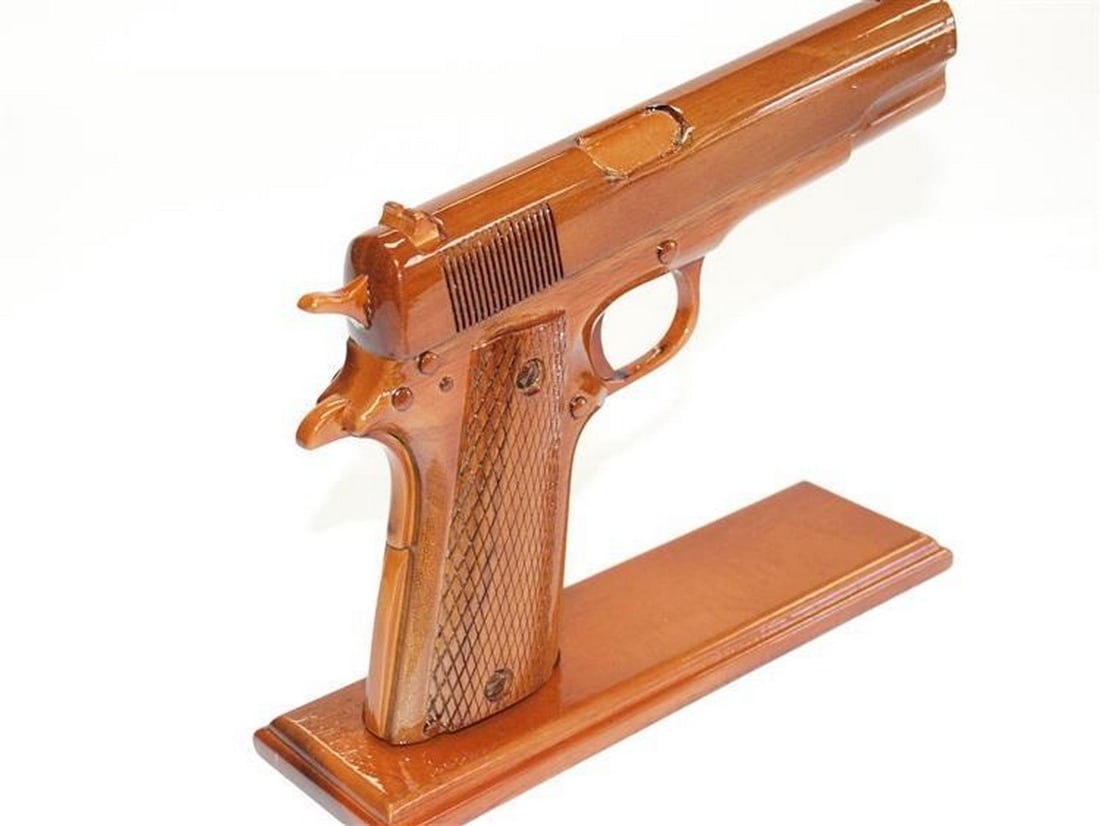 Wooden 45 Caliber Handgun Replica: Wooden 45 Caliber Handgun Replica Experience the craftsmanship and realism of our Wooden 45 Caliber Handgun Replica. Meticulously handcrafted from high-quality wood, this replica captures the