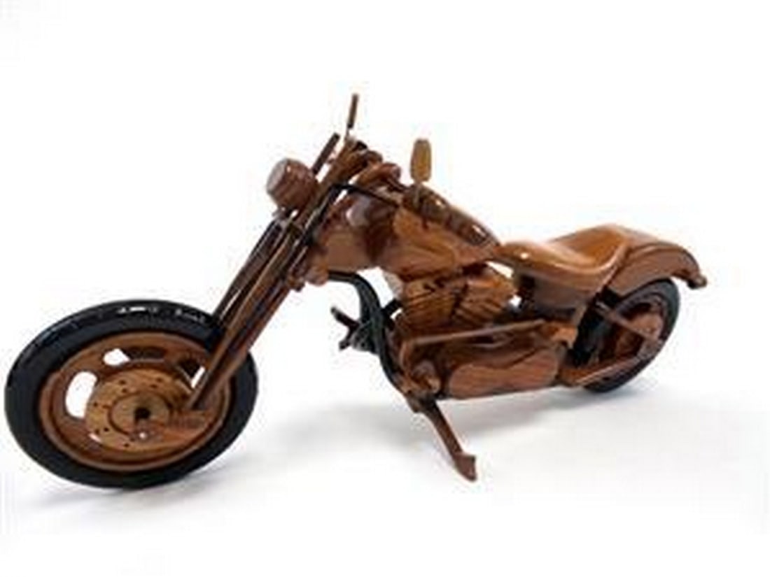 Chopper Bike: Chopper Bike This Chopper Bike motorcycle is handcrafted from solid mahogany. Hand carved details, wheels that roll, working kickstand and movable handlebars make this scale model an exquisite
