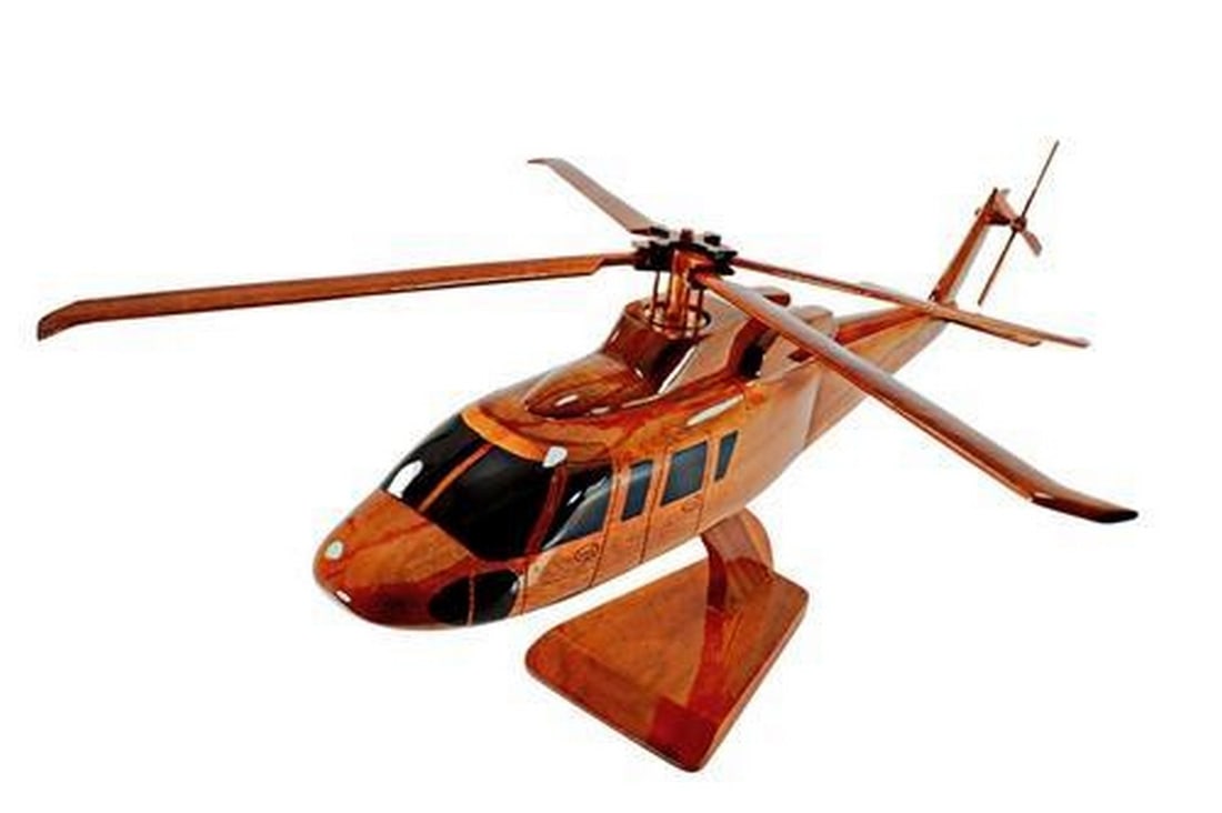 Sikorsky S-76 Helicopter: Sikorsky S-76 Helicopter Movable rotors make this scale model S-76 Helicopter a remarkable wood replica of the real military rotary wing craft. Handcrafted from solid mahogany and finely