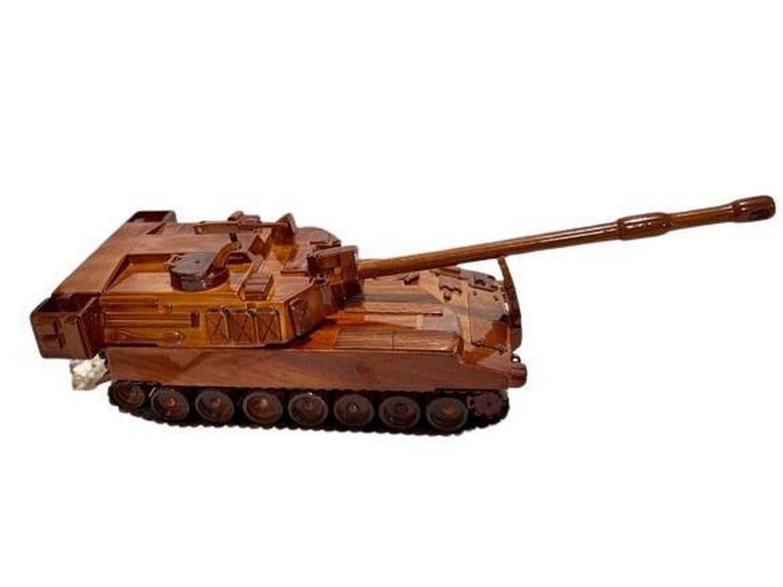 M-109 Paladin Howitzer: M-109 Paladin Howitzer Artisans meticulously carve and shape this exquisite M-109 model from a single block of solid mahogany, ensuring a level of craftsmanship that exemplifies precision and attenti