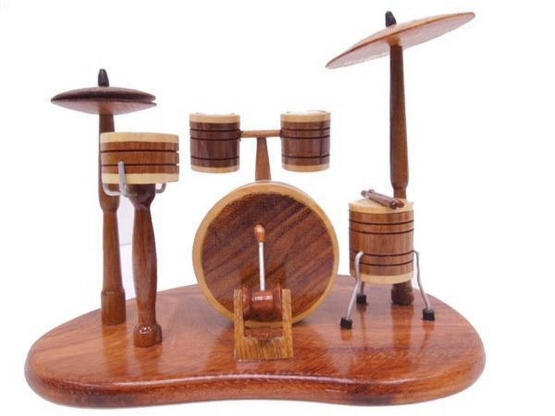 Drum Set: Drum Set Treat the musician in your home with this handcrafted drum set, modeled from mahogany with exceptional detail. Stand included. View photos for further details.