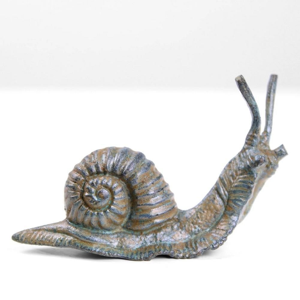 Aged Copper Snail Sculpture - (0.19lbs): Aged Copper Snail Sculpture - (0.19lbs) Representing slowness and quiet contemplation, this aged copper snail sculpture brings symbolic charm to any setting. Crafted from copper-zinc alloy using a