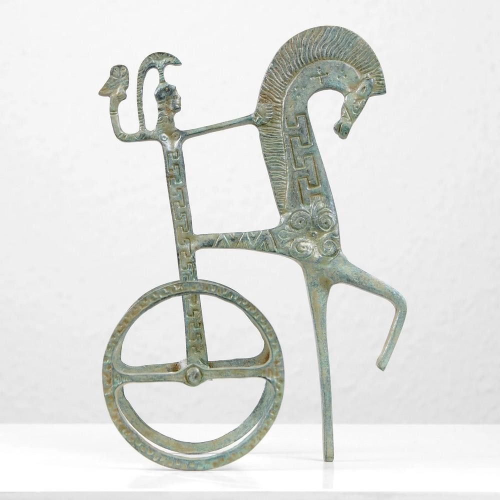 Bronze Statue of Greek Horse Chariot - 9" x 6.3": Bronze Statue of Greek Horse Chariot - 9" x 6.3" This striking Ancient Greek Chariot Statue depicts a victorious warrior riding a chariot in an abstract Greek style. The chariot,