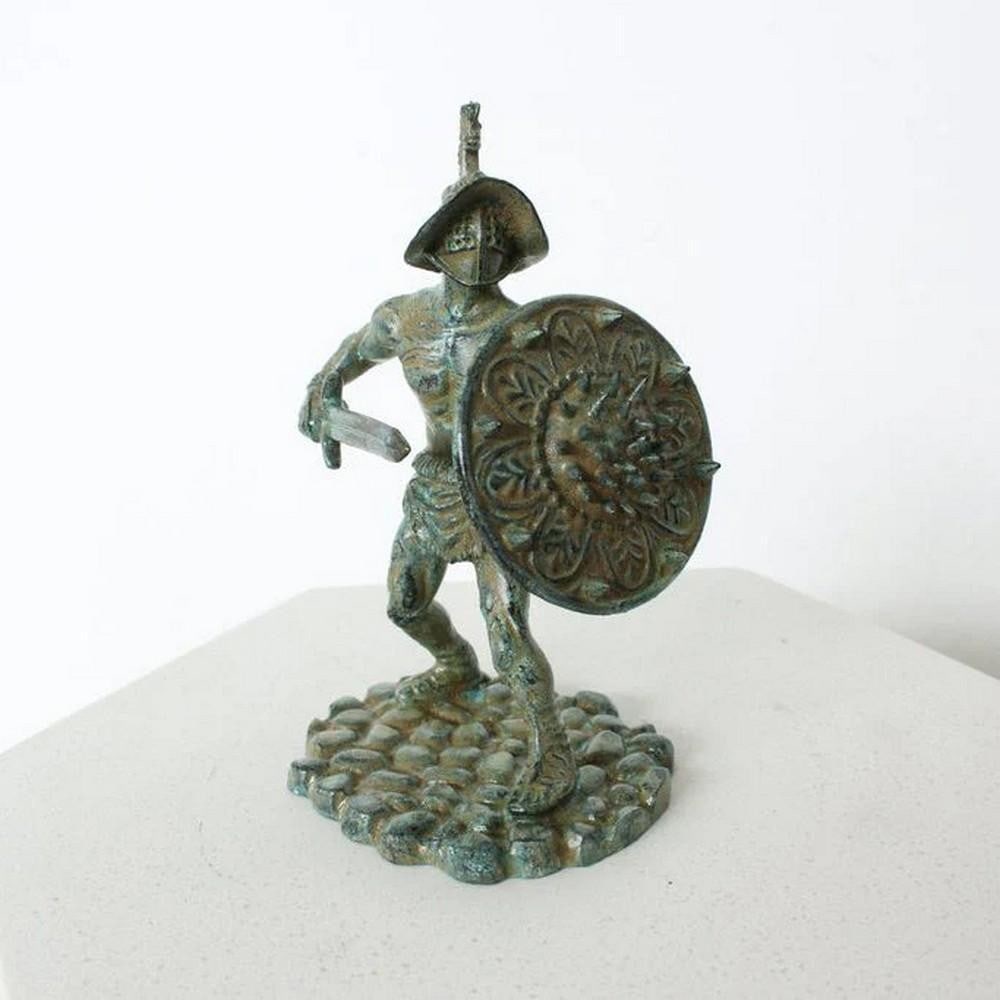 Thracian Gladiator with Spiked Shield – Aged Copper Sculpture - (2.2lbs): Thracian Gladiator with Spiked Shield – Aged Copper Sculpture - (2.2lbs) This fierce Thracian Gladiator sculpture captures the spirit of ancient combat with striking detail. Armed with a curved