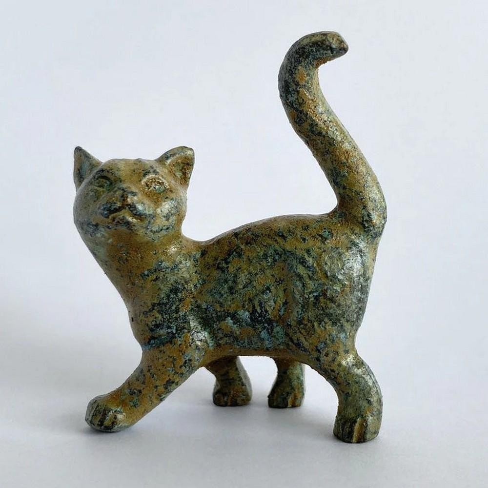 Walking Kitten Bronze Statuette - (0.9lbs): Walking Kitten Bronze Statuette - (0.9lbs) This playful bronze kitten captures a sweet moment in motion, with delicate carved details and a classic green patina. Perfectly sized for a desk or