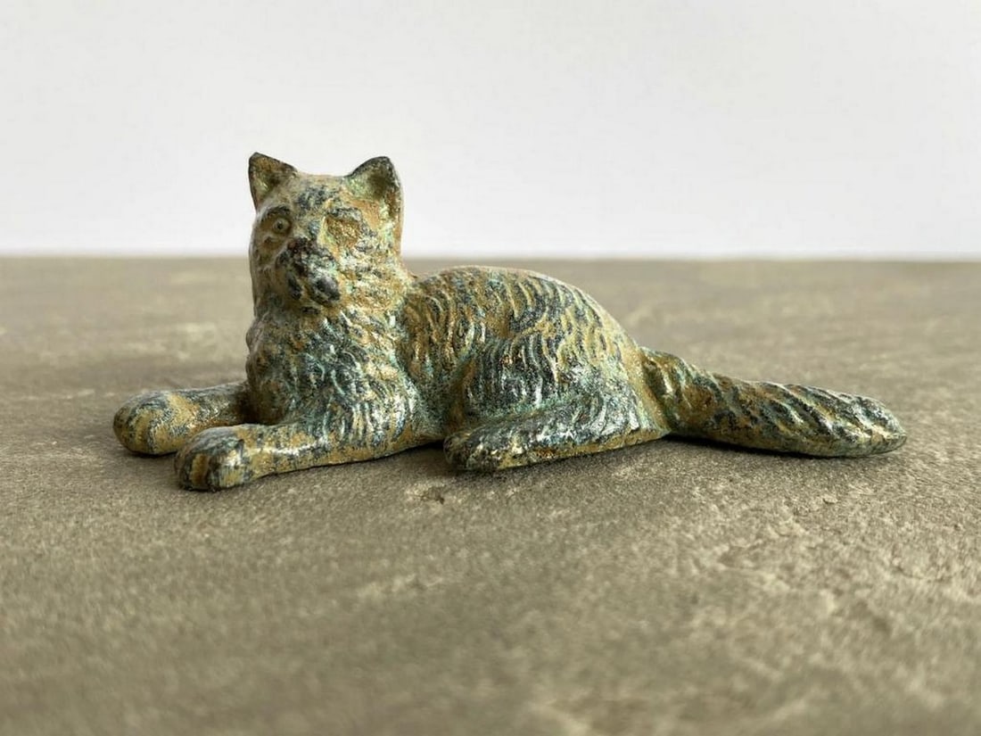 Lying Kitten Bronze Statuette in Aged Copper Finish - (0.9lbs): Lying Kitten Bronze Statuette in Aged Copper Finish - (0.9lbs) This sweet bronze kitten rests in a peaceful pose, brought to life with intricate carvings and a vintage green patina. Made from