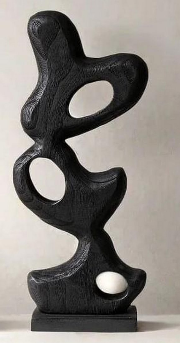 Ebon Flow – Abstract Wood Sculpture: Ebon Flow – Abstract Wood Sculpture This bold black wood sculpture features sweeping, organic curves carved into a vertical form that evokes fluid motion and modern elegance. Its polished finish and
