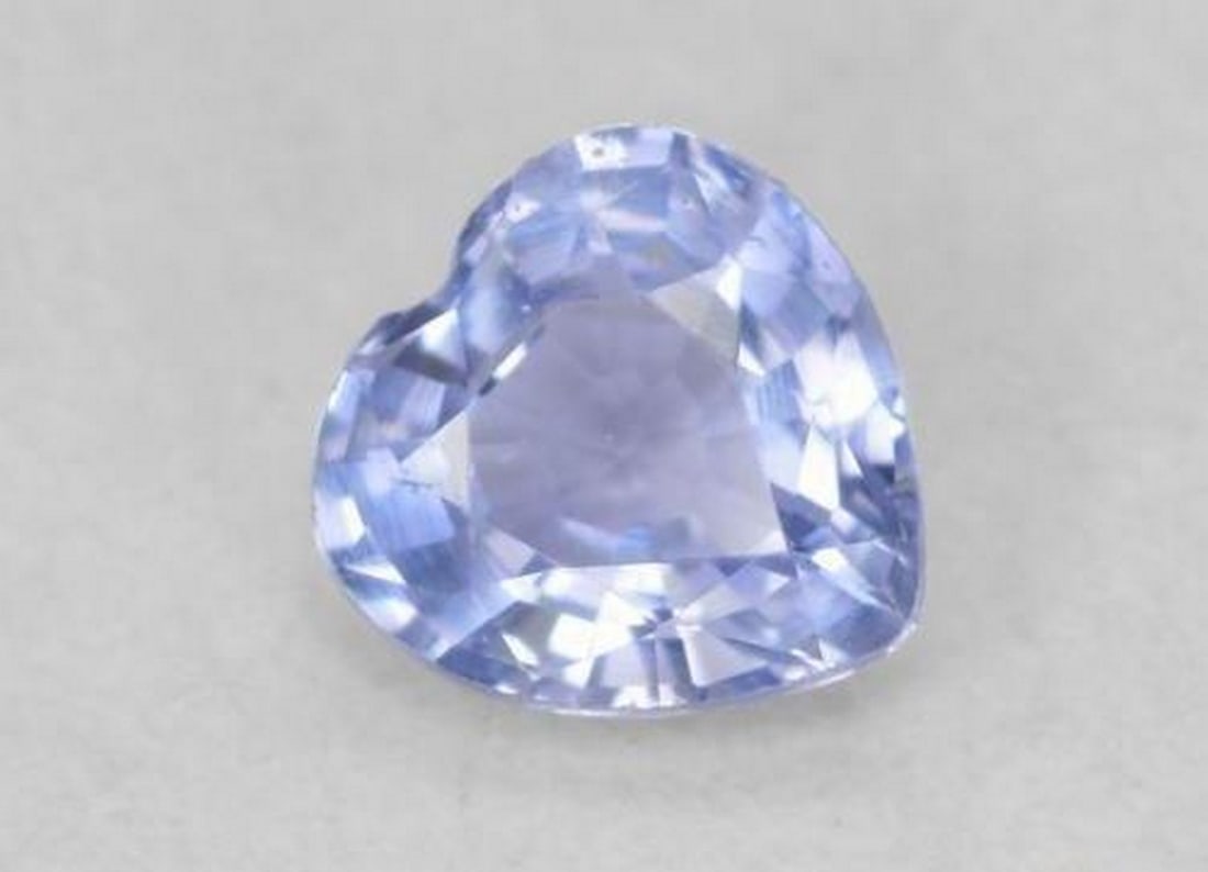 0.35ct Heart Cut Light Blue Sapphire: 0.35ct Heart Cut Light Blue Sapphire Specifications: Type: Sapphire Weight: 0.35 ct 1 Size:4.3 x 4.2 x 2.3 mm Shape: Heart Facet Color: Light Blue Clarity: V