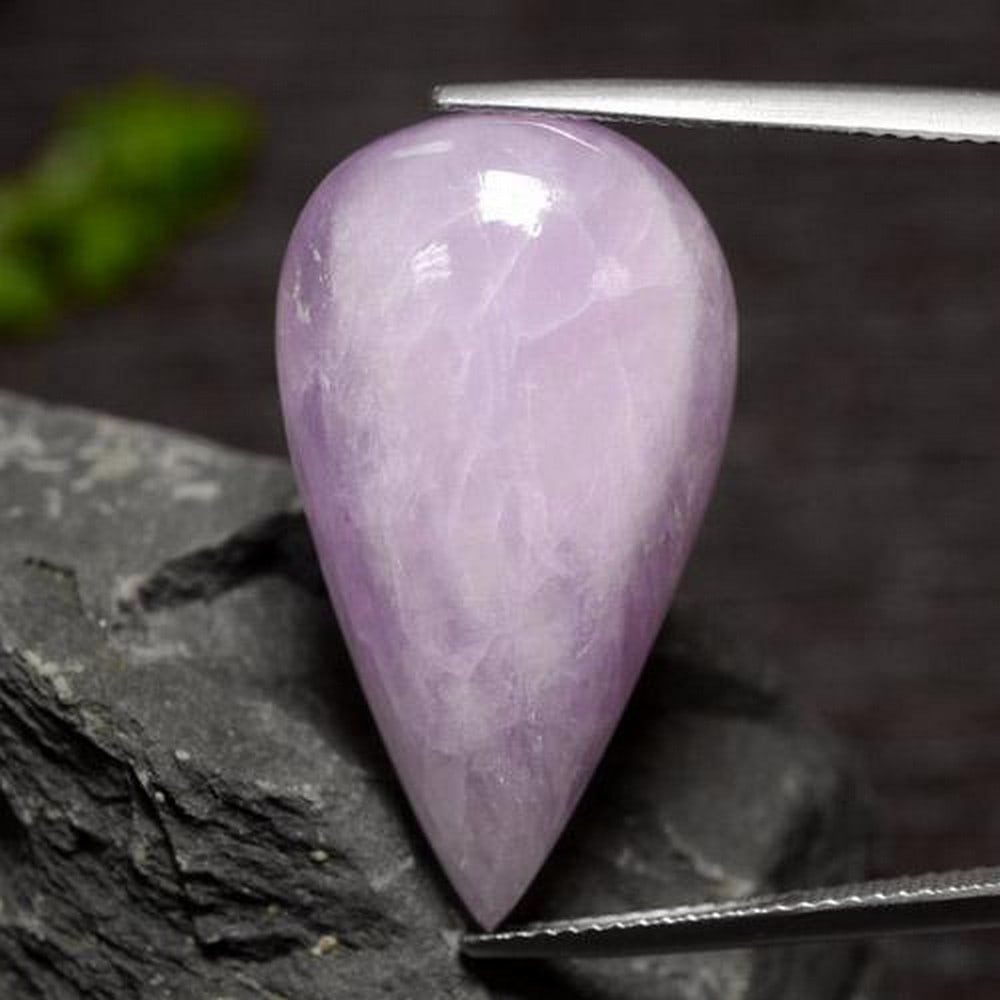 Pear Cabochon Violet Kunzite: Pear Cabochon Violet Kunzite Kunzite, a joyful stone, opens and connects the heart with the mind, encouraging communion between the two. While wearing kunzite, it is thought you are better able to