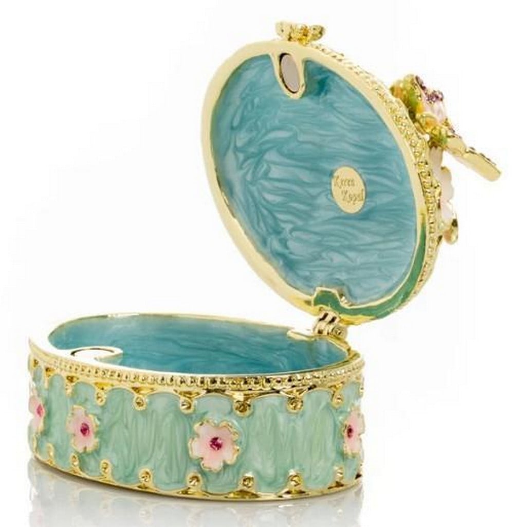 Garden Bloom Green Trinket Box: Garden Bloom Green Trinket Box Charming and elegant, this green trinket box is adorned with colorful floral accents that evoke the beauty of a spring garden. Delicately crafted with hand-painted