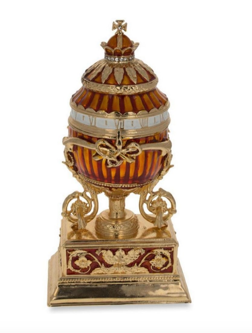 1899 Bouquet of Lilies Clock Royal Russian Inspired Egg: 1899 Bouquet of Lilies Clock Royal Russian Inspired Egg This hand-painted sparkling egg is adorned with a high-polished enamel with golden trim. The egg opens on a hinge and closes shut with a