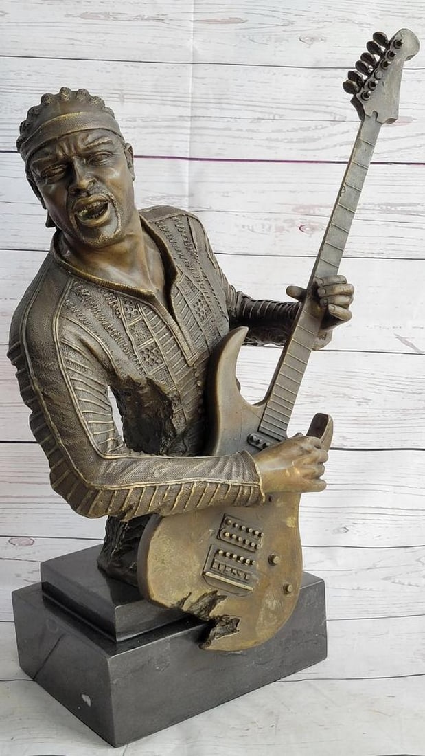 Original Bronze Sculpture of Jimi Hendrix by Williams - 18.5" x 17": Original Bronze Sculpture of Jimi Hendrix by Williams - 18.5" x 17" This remarkable bronze sculpture captures the essence of musical legend Jimi Hendrix in a striking form. Skillfully conveyi