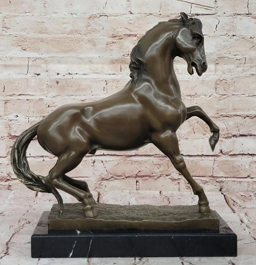 Untamed Power: Bronze Rearing Horse Sculpture: Untamed Power: Bronze Rearing Horse Sculpture Capturing a moment of pure energy and motion, this bronze sculpture features a horse rearing high on its hind legs, embodying strength, spirit, and untam