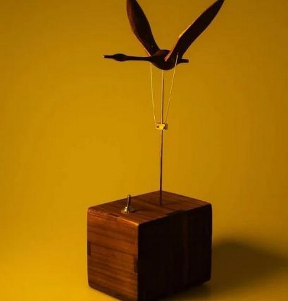 Swan Serenade Handcrafted Walnut Wood Musical Swan Automaton: Swan Serenade Handcrafted Walnut Wood Musical Swan Automaton Graceful and enchanting, this battery-powered automaton features a beautifully handcrafted swan made from rich walnut wood. Powered by a s