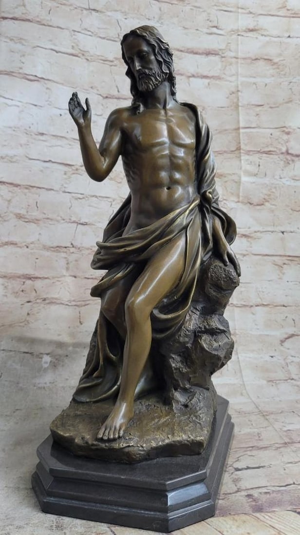 Handmade Bronze Sculpture of Jesus Christ by Valli - 17" x 9": Handmade Bronze Sculpture of Jesus Christ by Valli - 17" x 9" This exquisite handmade bronze sculpture depicts Jesus Christ seated on a rock, draped in a flowing robe that gracefully entwines