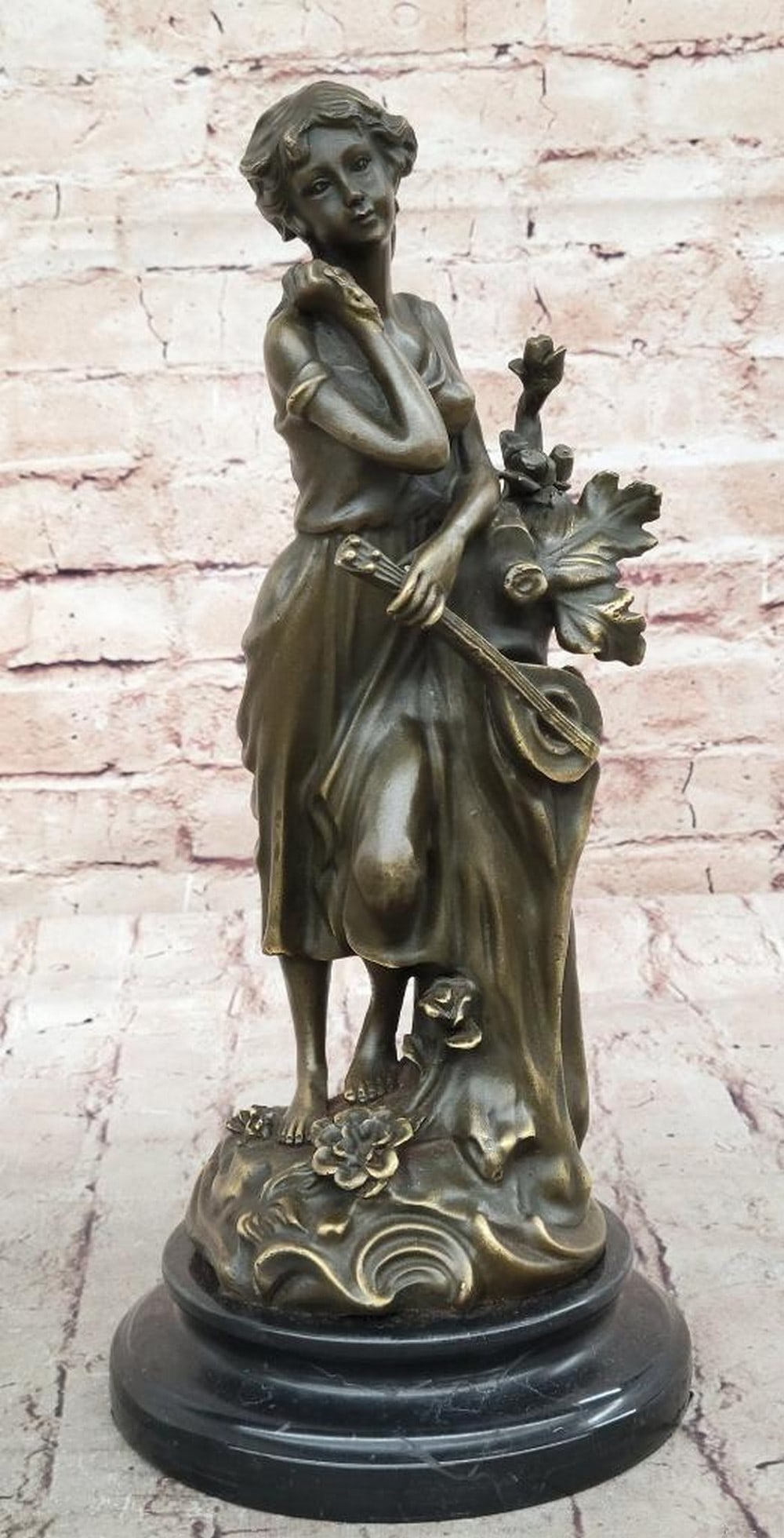 Woman Musician Playing Banjo Guitar Bronze Sculpture by Milo - 13" x 6": Woman Musician Playing Banjo Guitar Bronze Sculpture by Milo - 13" x 6" Celebrate the joy of music with this captivating bronze sculpture of a woman musician playing the banjo guitar. Crafted