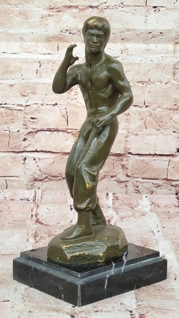 Bruce Lee "Star of the Century" Bronze Statue by Mavchi - 11.5" x 5": Bruce Lee "Star of the Century" Bronze Statue by Mavchi - 11.5" x 5" This Limited Edition Bruce Lee Bronze Statue, titled "Star of the Century," is a masterful tribute to the