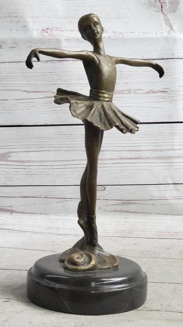 Posing Ballerina Dancer Bronze Statue - 11" x 8": Posing Ballerina Dancer Bronze Statue - 11" x 8" This captivating bronze sculpture skillfully captures the grace of a young ballet dancer frozen in a moment of poise and beauty. Meticulousl