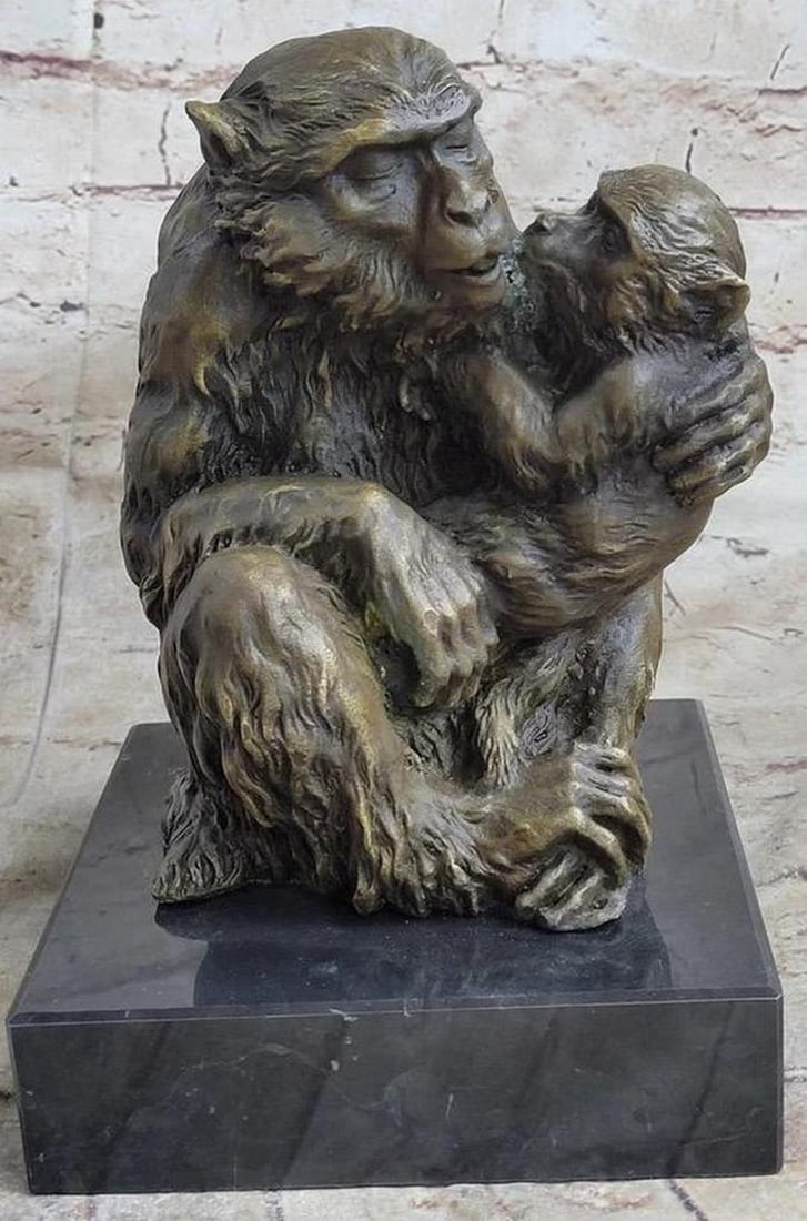 Mother Chimp Holding Baby Bronze Statue - 9.5" x 6": Mother Chimp Holding Baby Bronze Statue - 9.5" x 6" Witness the strength and beauty of a mother's love in this captivating animal sculpture, symbolizing the unbreakable bond between