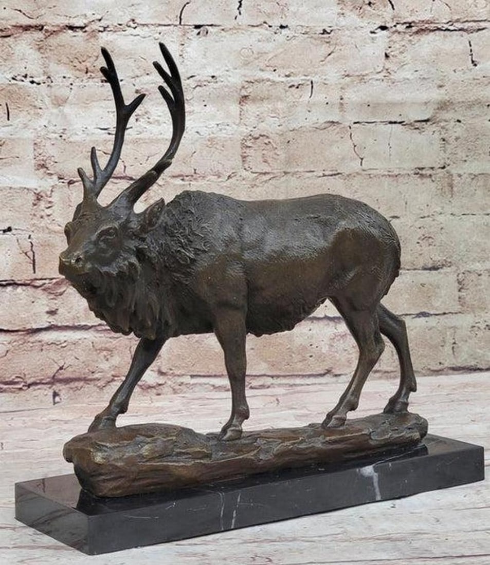 Skulking Caribou Stag Bronze Statue - 9.5" x 10": Skulking Caribou Stag Bronze Statue - 9.5" x 10" Picture the Reindeer (Caribou) gracefully inhabiting the tundra of a northern landscape, its melodic calls resonating through the crisp air