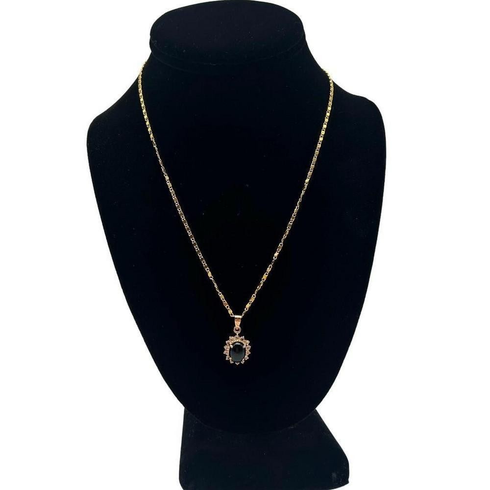 Black Onyx Center Stone CZ Pendant Necklace: Black Onyx Center Stone CZ Pendant Necklace At the heart of the pendant lies a lustrous black onyx stone, renowned for its deep black hue and smooth, polished surface. The onyx stone is expertly cut