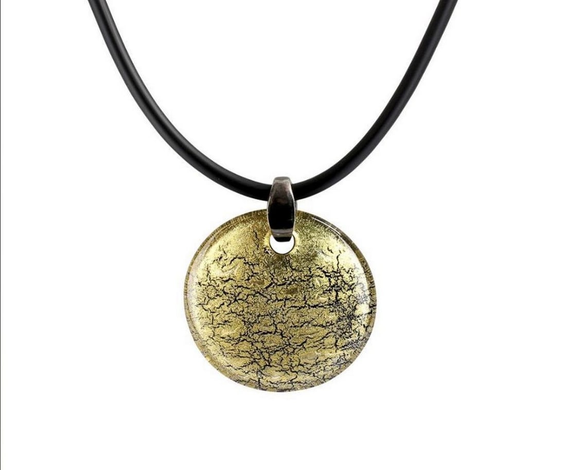Gold Murano Glass Pendant: Gold Murano Glass Pendant A stunning venetian glass pendant necklace. The pendant is handmade in Murano glass with the technique of submerged glass over a silver leaf. This pendant is simple and