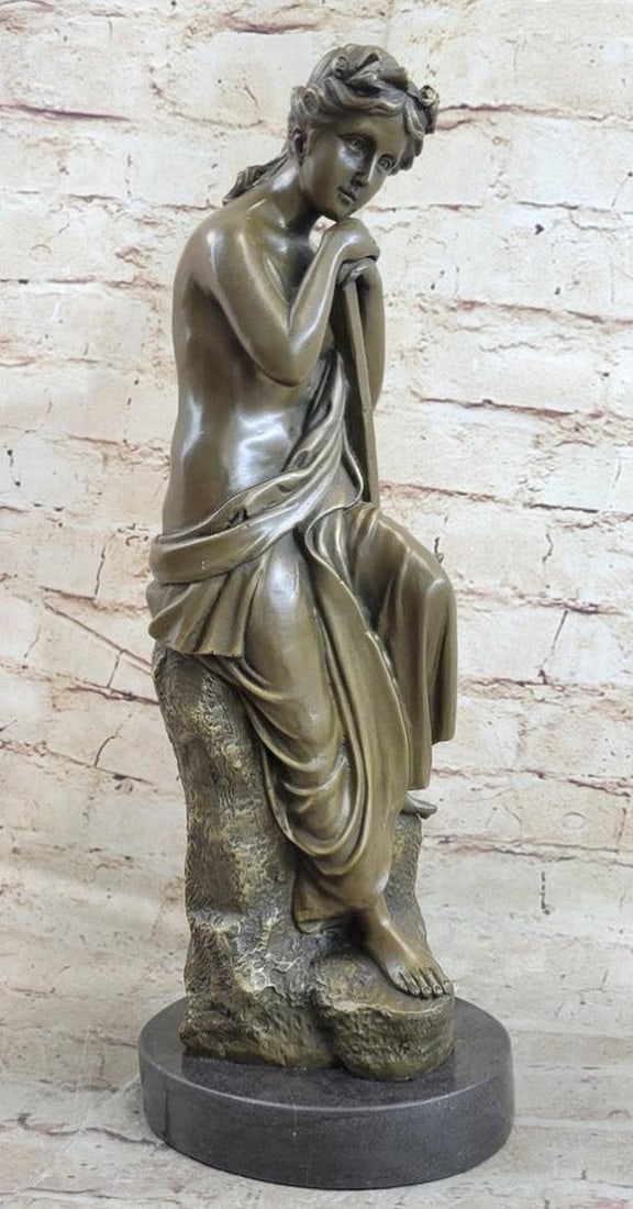 Hard Working Woman Resting on a Rock Bronze Sculpture: Hard Working Woman Resting on a Rock Bronze Sculpture The young woman sits pensively on a high rock. Her head rests on her hands as her gaze focuses downwards. She is dressed in the semi- nude. A gar