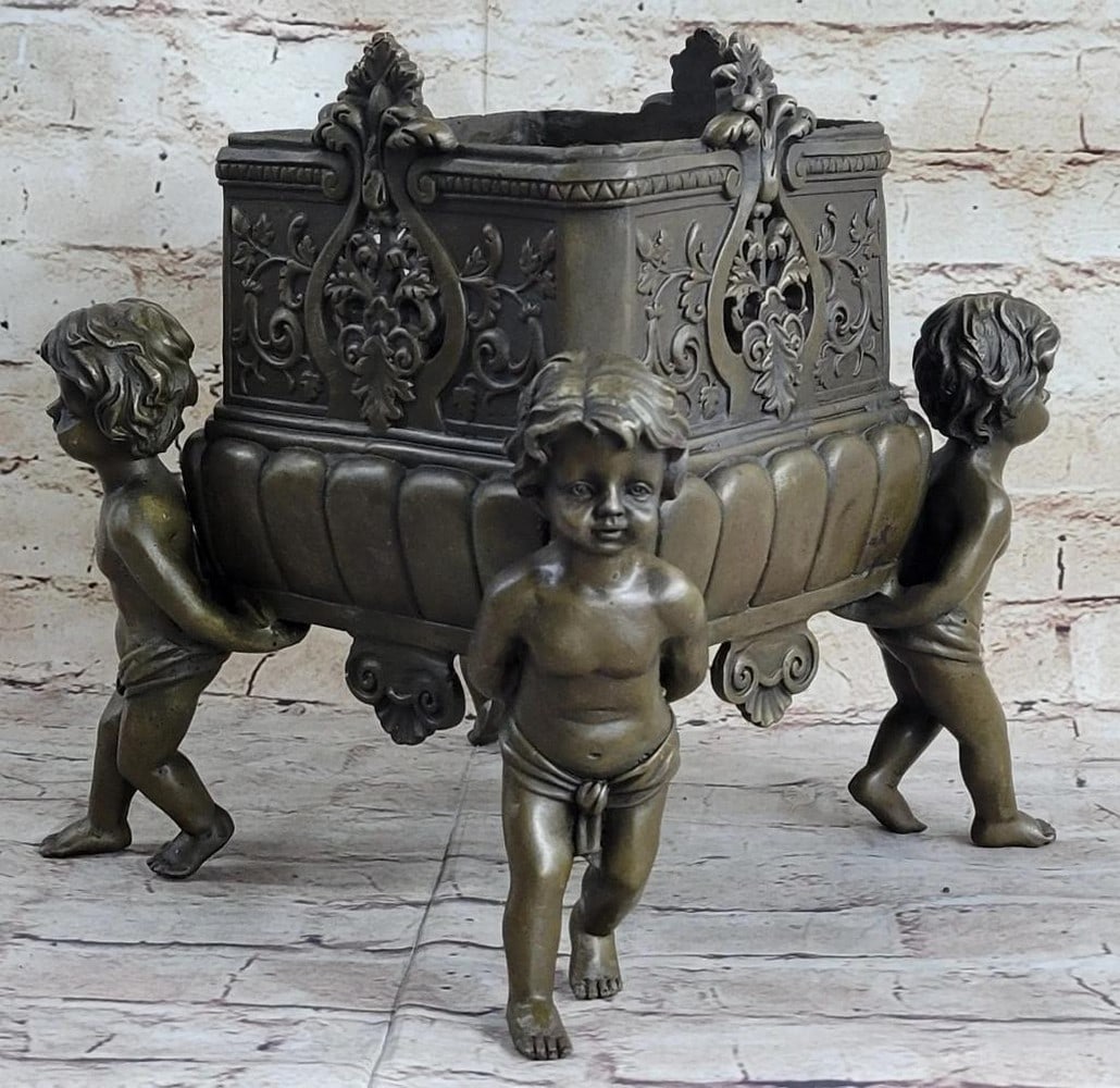 Four Identical Boy Footed Bronze Planter Sculpture After Joseph Cheret - 13lbs: Immerse yourself in the exquisite craftsmanship of this attributed Joseph Cheret bronze jaradiniere. With its natural brown color patina, this planter exudes a timeless allure, captivating the eye wit