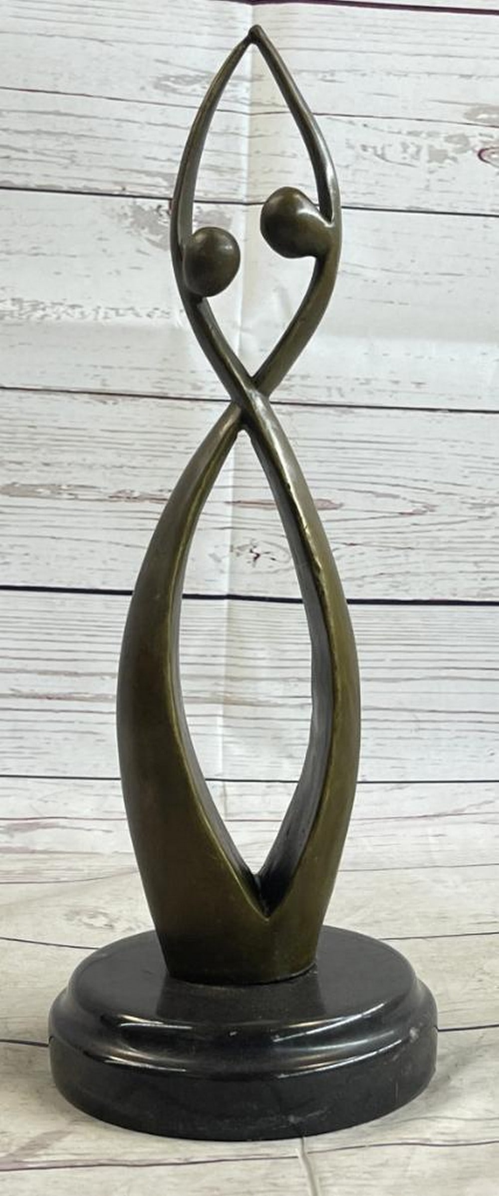 Abstract Intertwined Beings Original Bronze Statue - 13" x 4": Abstract Intertwined Beings Original Bronze Statue - 13" x 4" This striking bronze sculpture symbolizes unity and love in an abstract form, merging two beings into a harmonious whole resembl