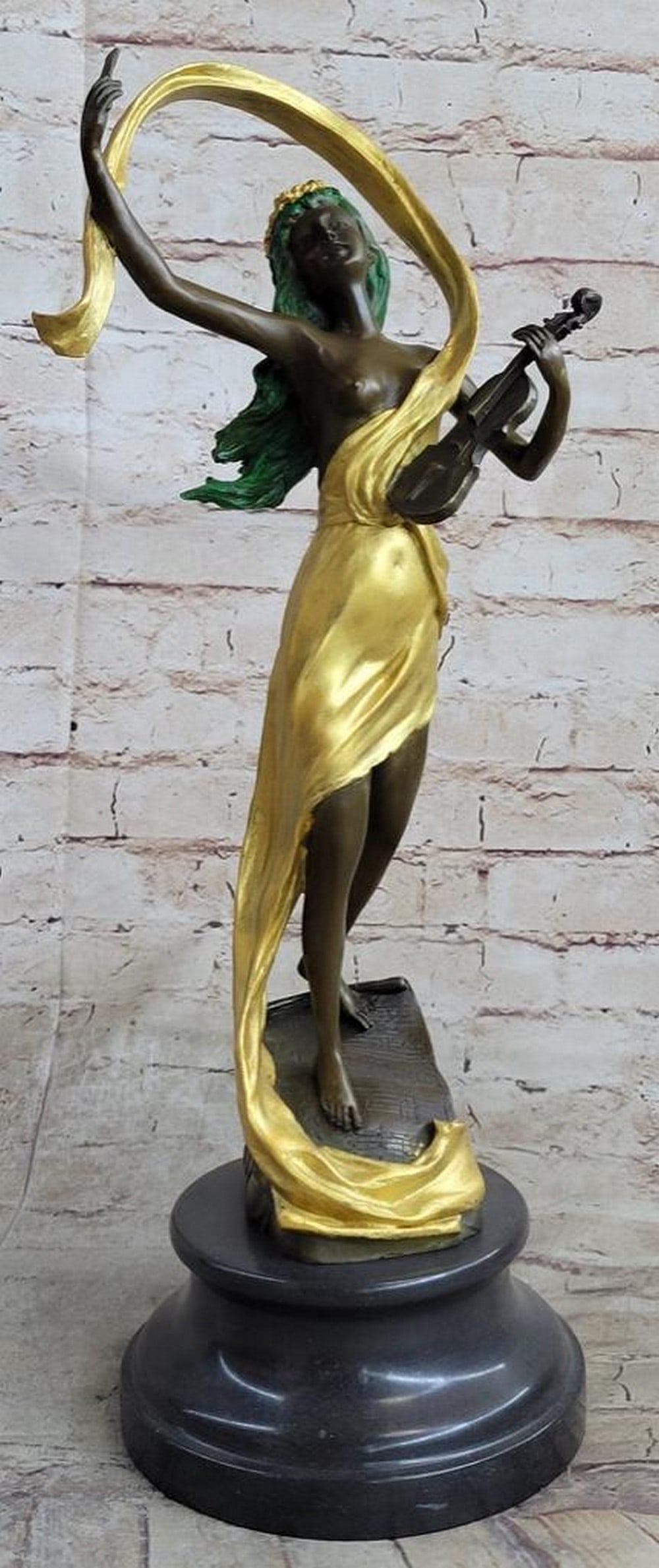 Majestic Female Violin Player Bronze Sculpture: Majestic Female Violin Player Bronze Sculpture A young woman finishes a powerful ballad on her violin. Her musical notes lift into the air that swirls around her, blowing her hair off her face. Her g