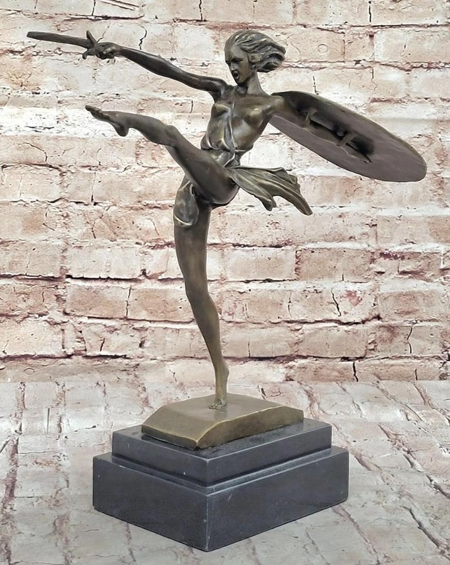 Fierce Warrior Woman Bronze Sculpture by B. Zach - 15" x 17": Fierce Warrior Woman Bronze Sculpture by B. Zach - 15" x 17" This powerful bronze sculpture by B. Zach captures the fearless spirit of a warrior woman in the heat of battle. With a high kick a