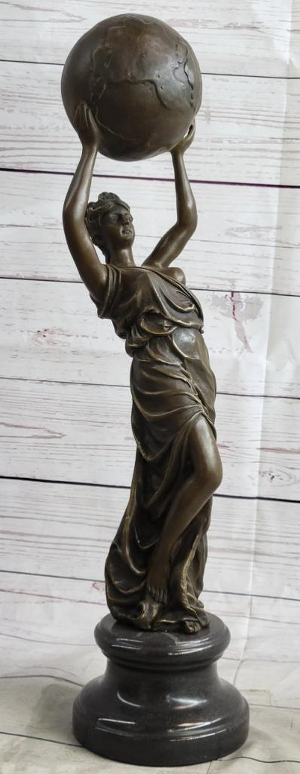 Worldly Strength Bronze Sculpture by Jean Patoue - 20" x 5.5": Worldly Strength Bronze Sculpture by Jean Patoue - 20" x 5.5" "Worldly Strength" is a powerful and evocative bronze sculpture that celebrates both the grace and strength of femininity.