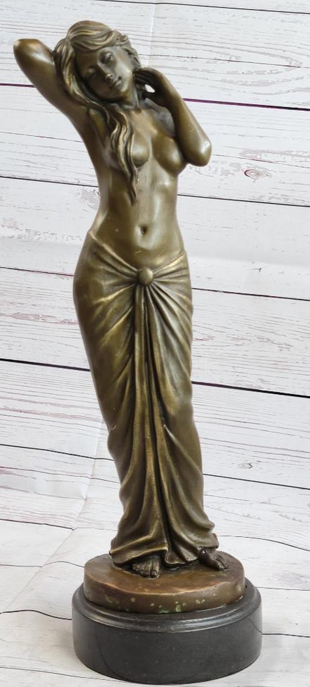 Precious Nude Lady Bronze Sculpture: Precious Nude Lady Bronze Sculpture The sculpture emphasizes the art and beauty of a woman. She is seen at liberty perhaps in the privacy of her chambers wearing only a ankle-lengt