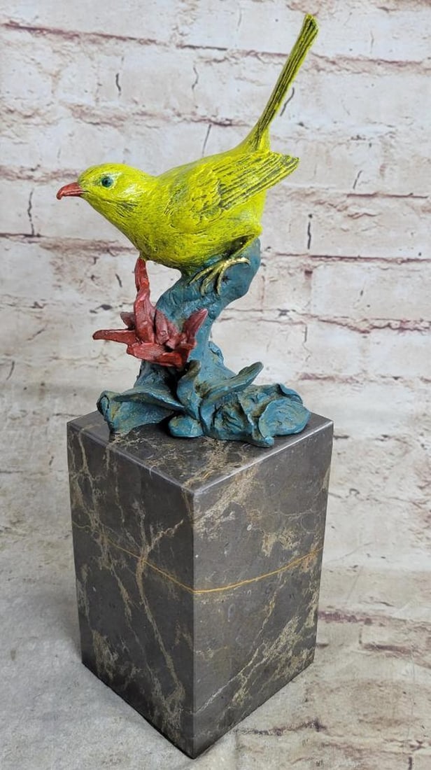 Signed Original Yellow Songbird Bronze Sculpture - 11" x 5": Signed Original Yellow Songbird Bronze Sculpture - 11" x 5" Immerse yourself in the enchanting world of the Birds of Paradise with these exquisite bronze figurines. Perched gracefully on a br