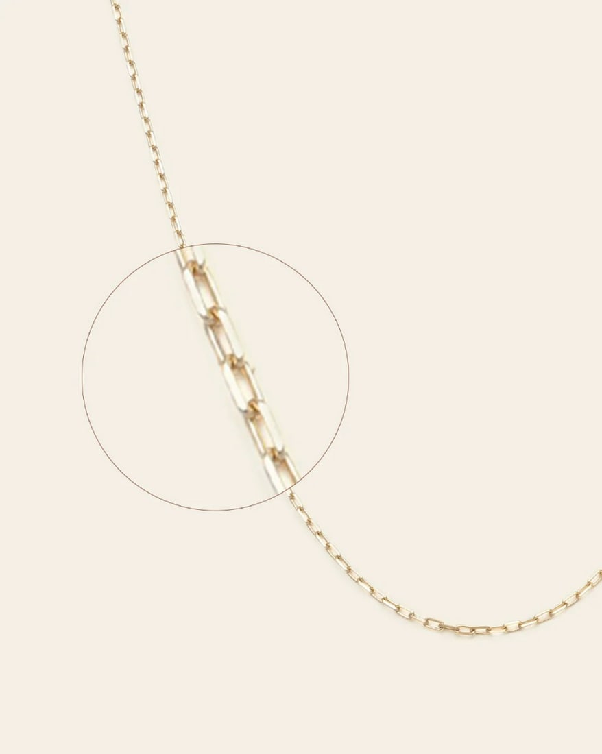 10k Solid Gold Women's Staple Chain: 10k Solid Gold Women's Staple Chain This 10K solid gold staple chain is a refined essential for any jewelry collection. Its sleek, minimalist design highlights the warm glow of gold, making it a