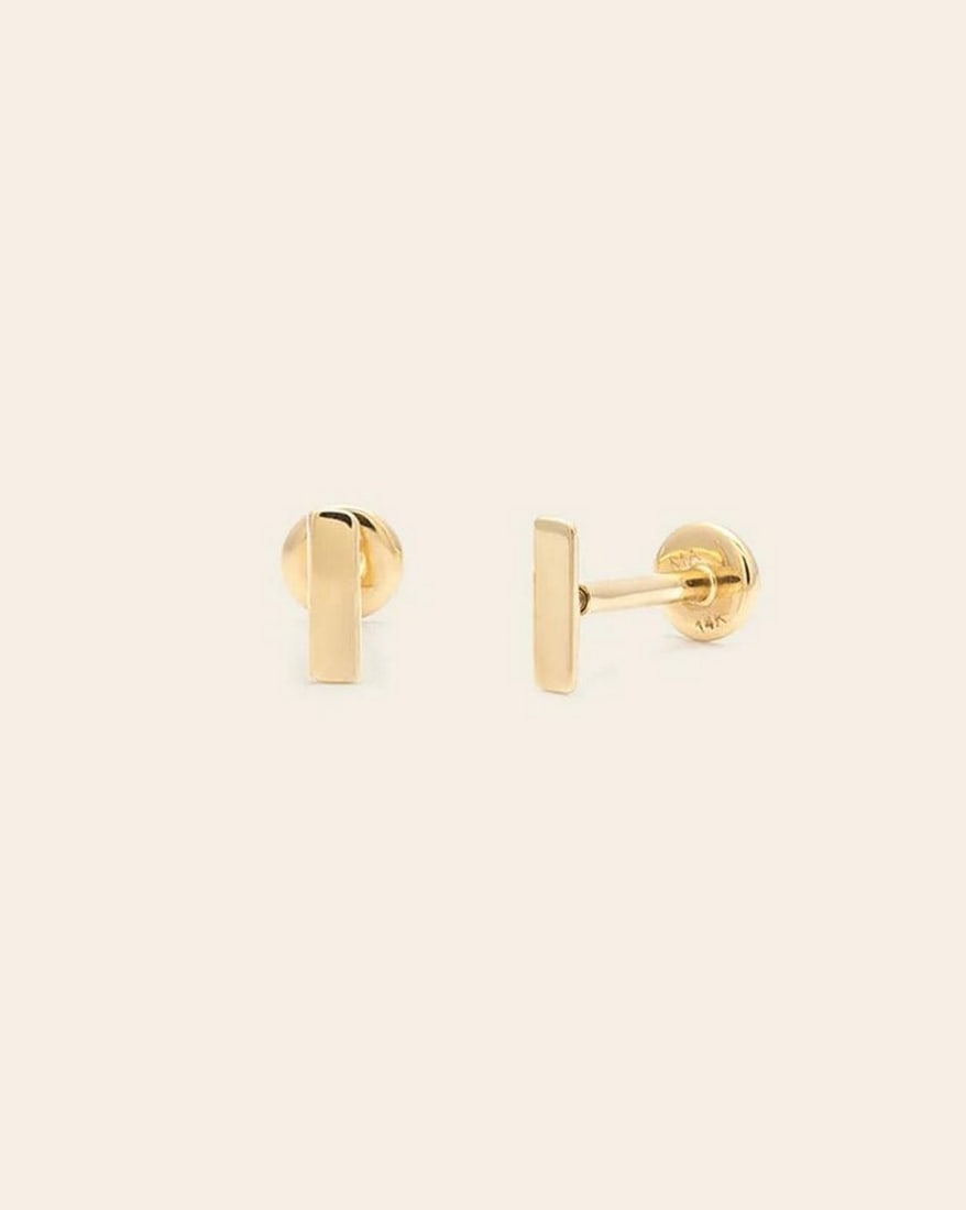 14k Solid Gold Bar Stud Earrings: 14k Solid Gold Bar Stud Earrings These 14K solid gold bar stud earrings are a minimalist essential with timeless appeal. Featuring sleek, polished bars, they offer a modern yet understated look that