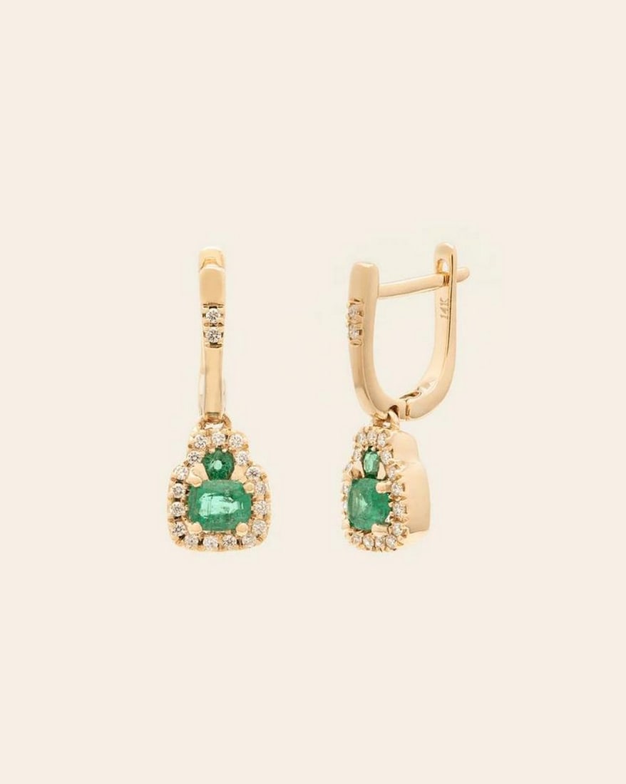 14k solid gold Emerald & Diamond Huggie Earrings: 14k solid gold Emerald & Diamond Huggie Earrings These 14K solid gold emerald and diamond huggie earrings combine vibrant color with sparkling elegance. Featuring rich green emeralds paired