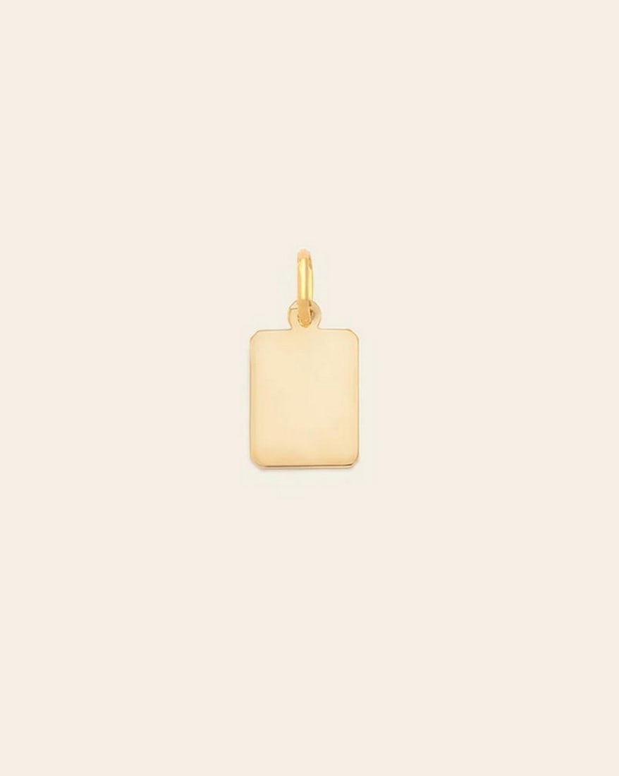 14k Vermeil Gold Plated Mini Tag Pendant: 14k Vermeil Gold Plated Mini Tag Pendant This 14k Vermeil Gold Plated Mini Tag Pendant combines modern simplicity with refined elegance. Crafted in 14k gold vermeil, its sleek rectangular design