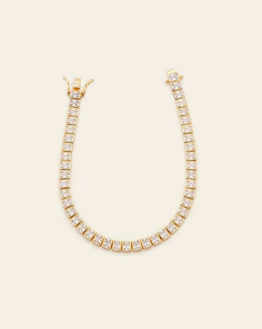 Emerald Cut CZ Stones Tennis Bracelet: Emerald Cut CZ Stones Tennis Bracelet This Emerald Cut CZ Stones Tennis Bracelet is a dazzling statement of elegance and refinement. Featuring a row of precisely cut cubic zirconia stones in a