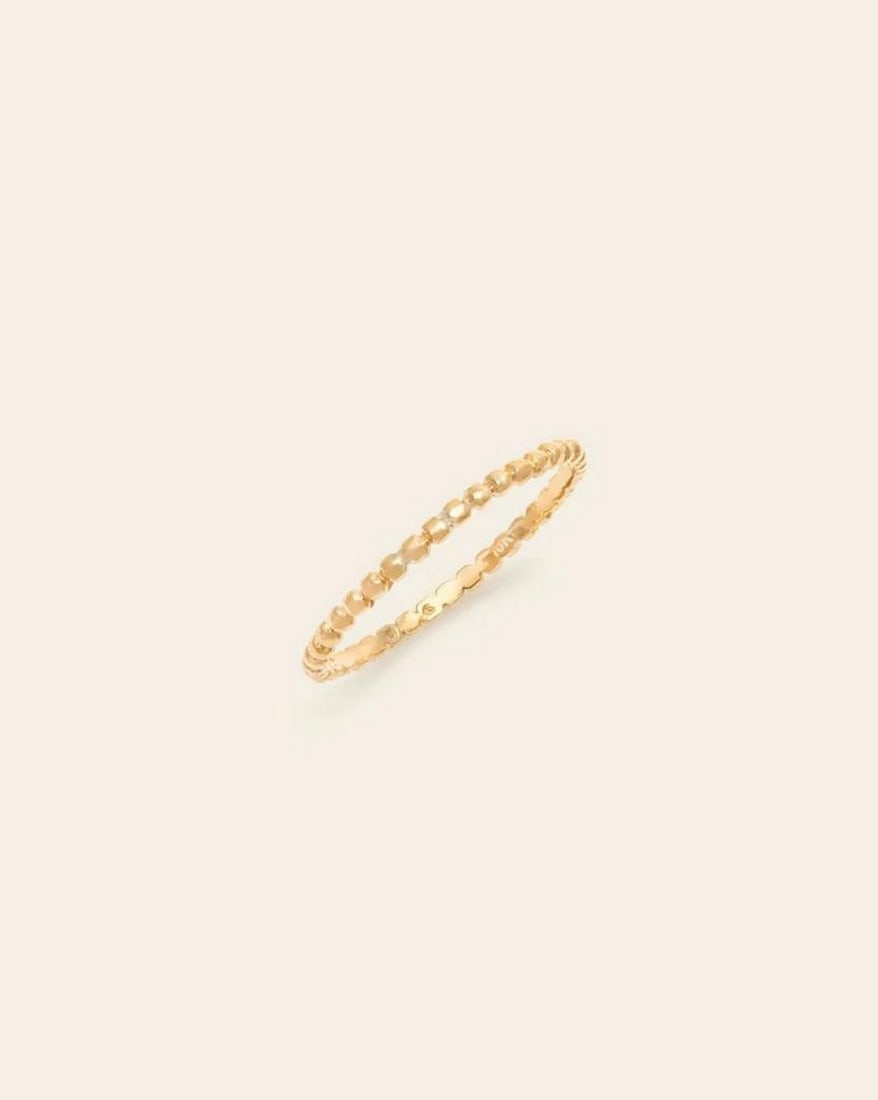 10k Solid Gold Beaded Band Ring: 10k Solid Gold Beaded Band Ring This 10k Solid Gold Beaded Band Ring is a classic piece with a contemporary twist. Featuring a delicate row of polished gold beads, it offers texture and shine in a