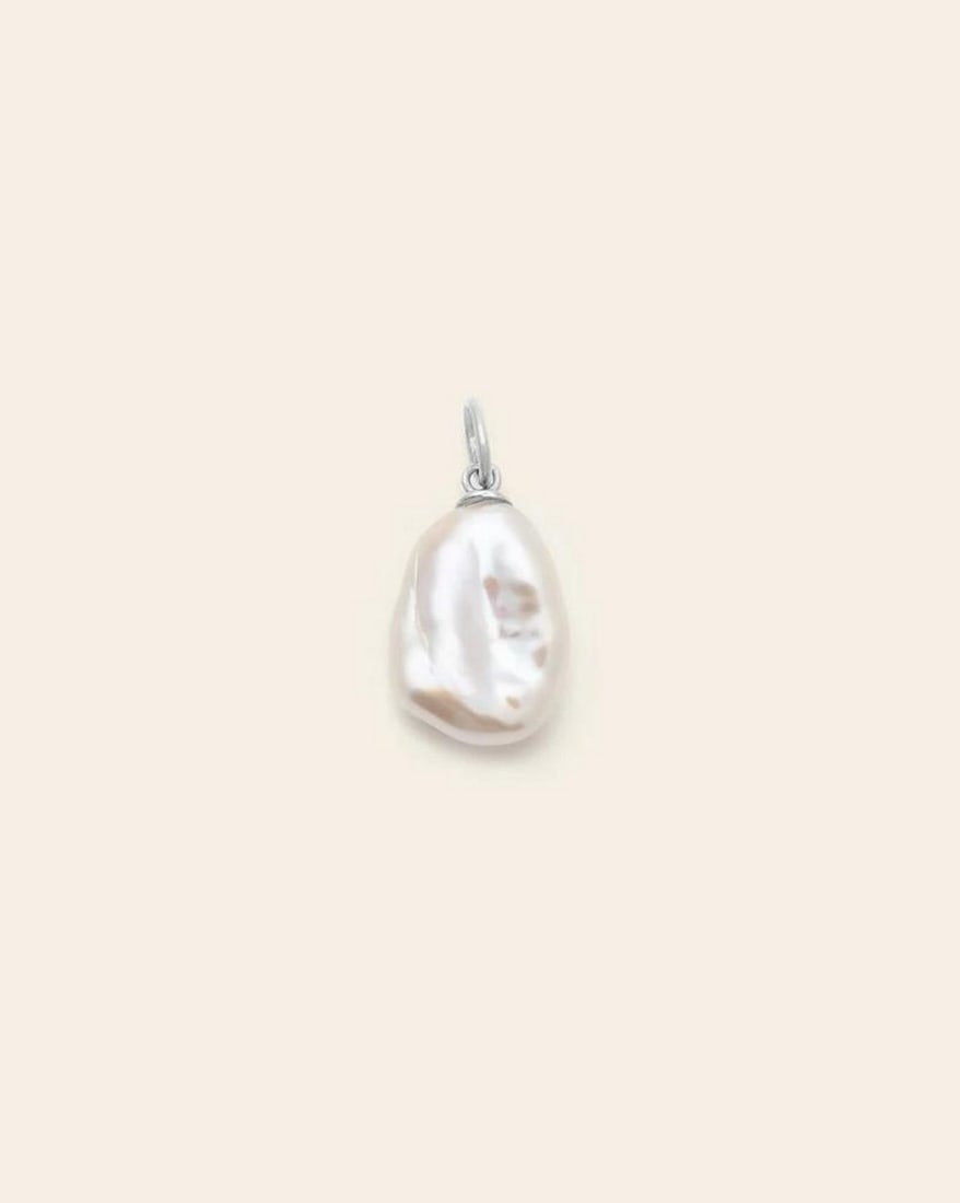 Sterling Silver Medium Baroque Pearl Pendant: Sterling Silver Medium Baroque Pearl Pendant A symbol of prosperity and good fortune, this timeless freshwater pearl pendant is the perfect complement to your favorite chain or hoops. Crafted in