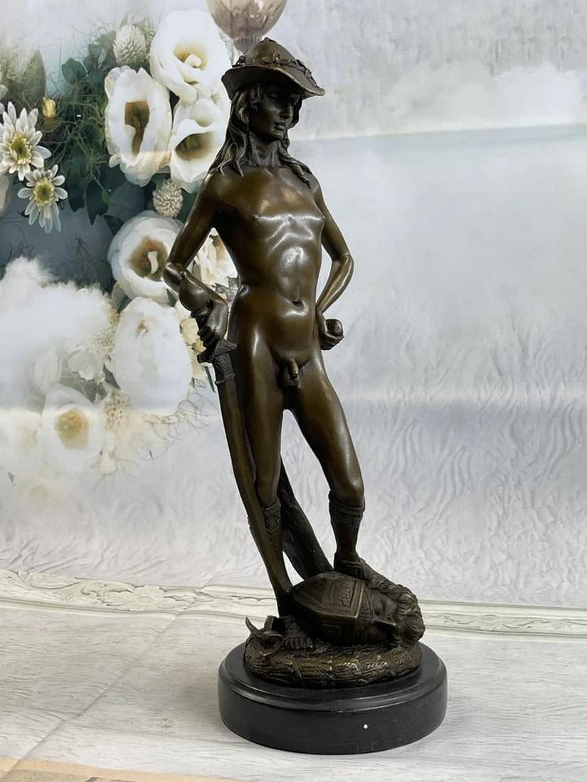 Timeless Triumph: Rendition of Donatello's David Inspired Bronze Statue: Timeless Triumph: Rendition of Donatello's David Inspired Bronze Statue This renowned sculpture, depicting the biblical hero's victorious stance after defeating Goliath, is a testament to cou