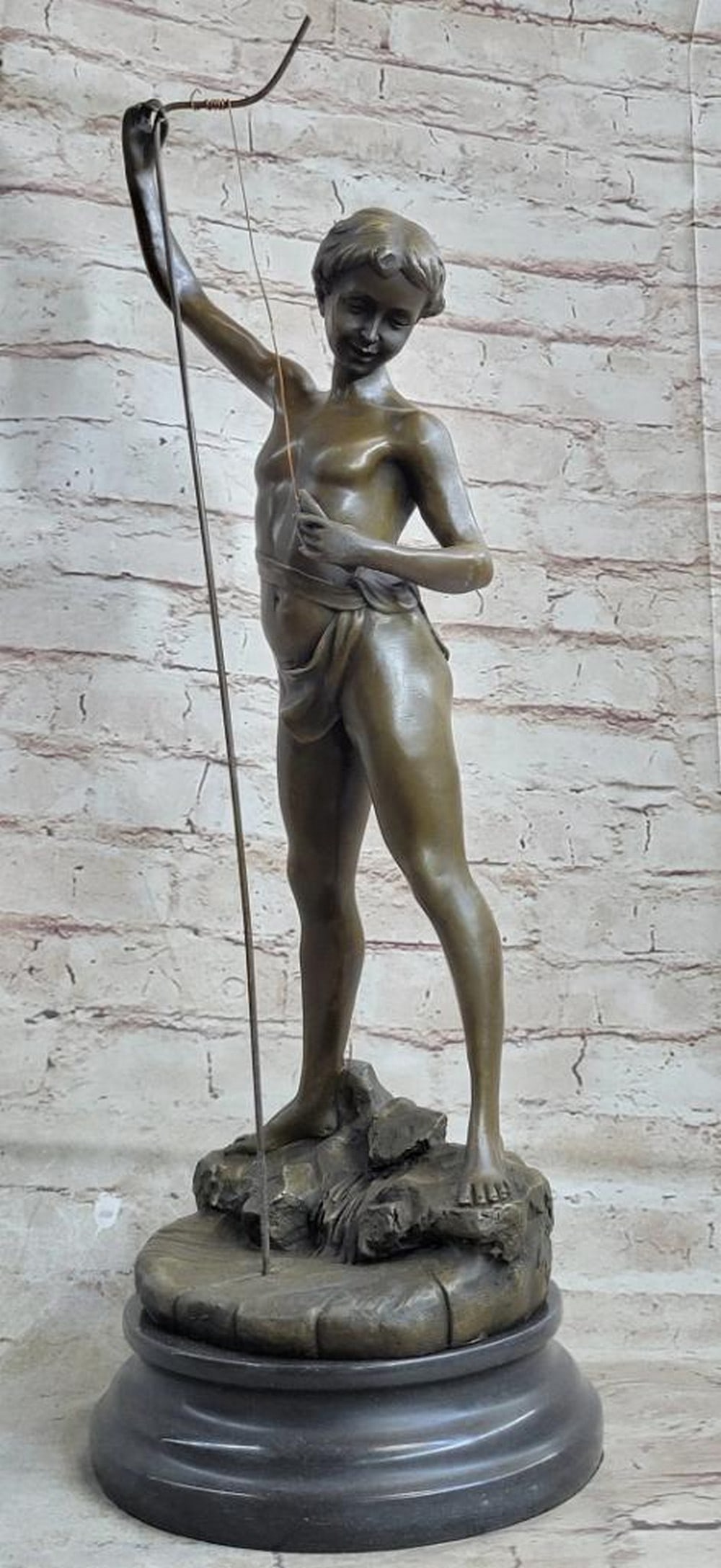 Nude Boy Holding a Rod with a Fish" Original Bronze Sculpture Signed by Art Taylor - 19.5" x 6.5: "Nude Boy Holding a Rod with a Fish" Original Bronze Sculpture Signed by Art Taylor - 19.5" x 6.5" Lose yourself in the contemplative beauty of this bronze sculpture by artist Art Tayl
