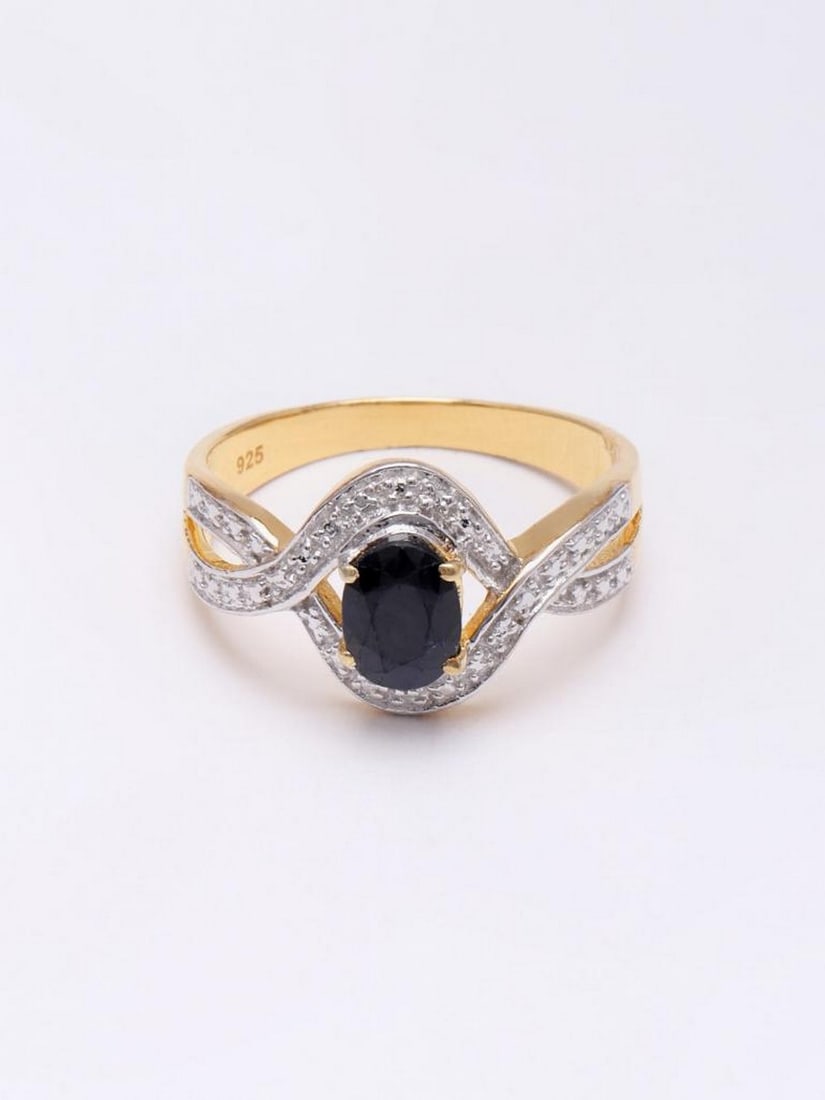 Sterling Silver Wave Design Ring with Faceted Black Onyx: Sterling Silver Wave Design Ring with Faceted Black Onyx This sleek and modern ring features a faceted black onyx centerpiece, known for its depth, clarity, and grounding energy. The polished sterling