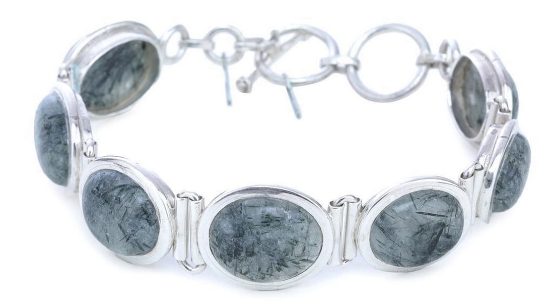 Rutilated Beads in Sterling Silver Bracelet: Rutilated Beads in Sterling Silver Bracelet This striking sterling silver bracelet features rutilated beads, each containing delicate needle-like inclusions that catch the light and create a