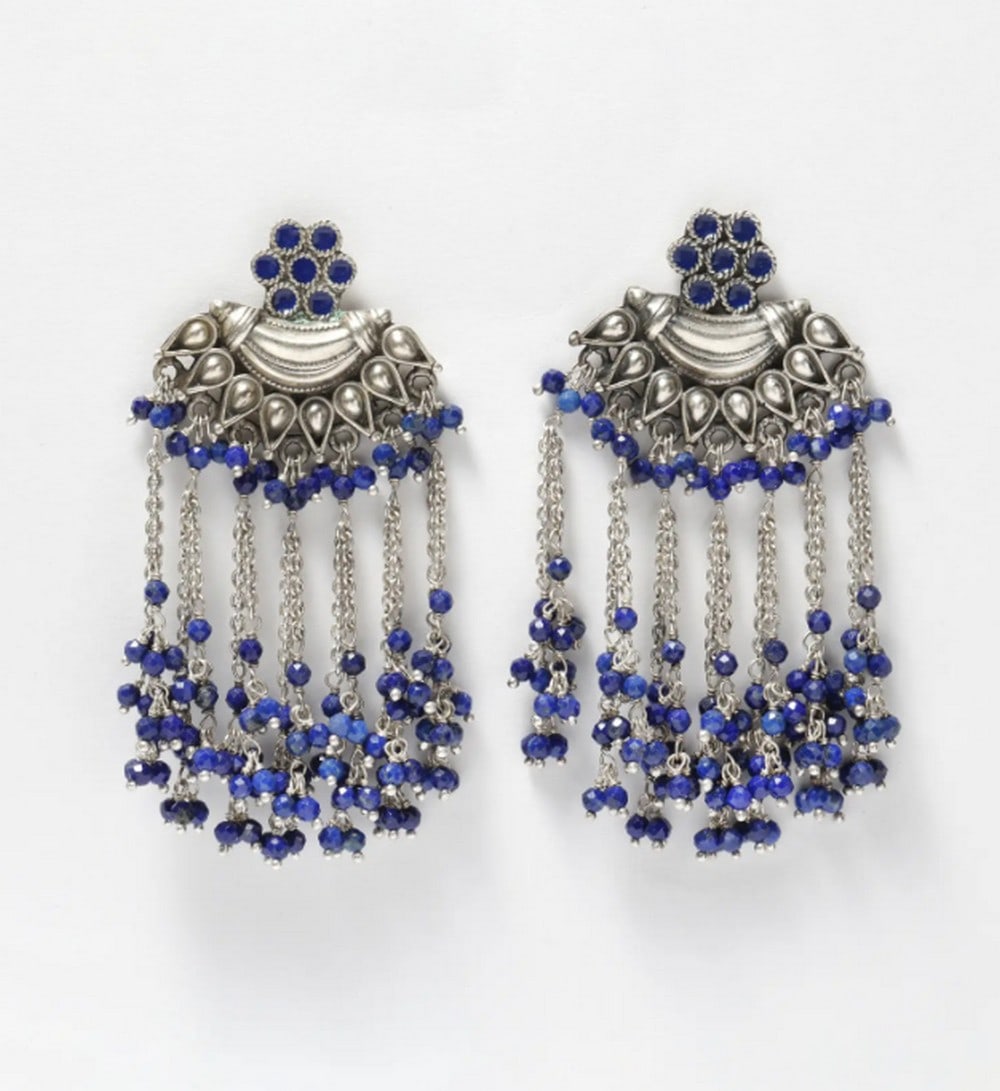 Regal Lapis Lazuli Dangles: Regal Lapis Lazuli Dangles These sterling silver Lapis Lazuli shower earrings showcase expert craftsmanship with deep blue beads and intricate detailing. Blending traditional charm with modern