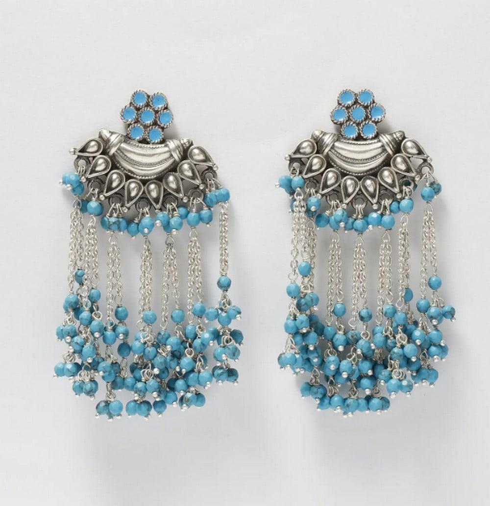 Desert Sky Turquoise Drops: Desert Sky Turquoise Drops These Arizona Turquoise Sterling Silver Earrings blend traditional craftsmanship with modern elegance. Featuring hand-set turquoise stones in a cascading design, they
